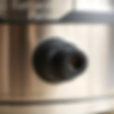 Steam Release Mechanism Explained The steam release valve on a pressure cooker in focus